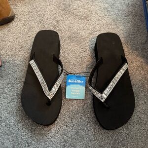 Sun & Sky Black Flip Flops with Silver Accents